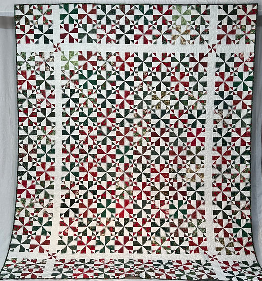 Whirligig Holiday Quilt with Pillow Sleeve (King)